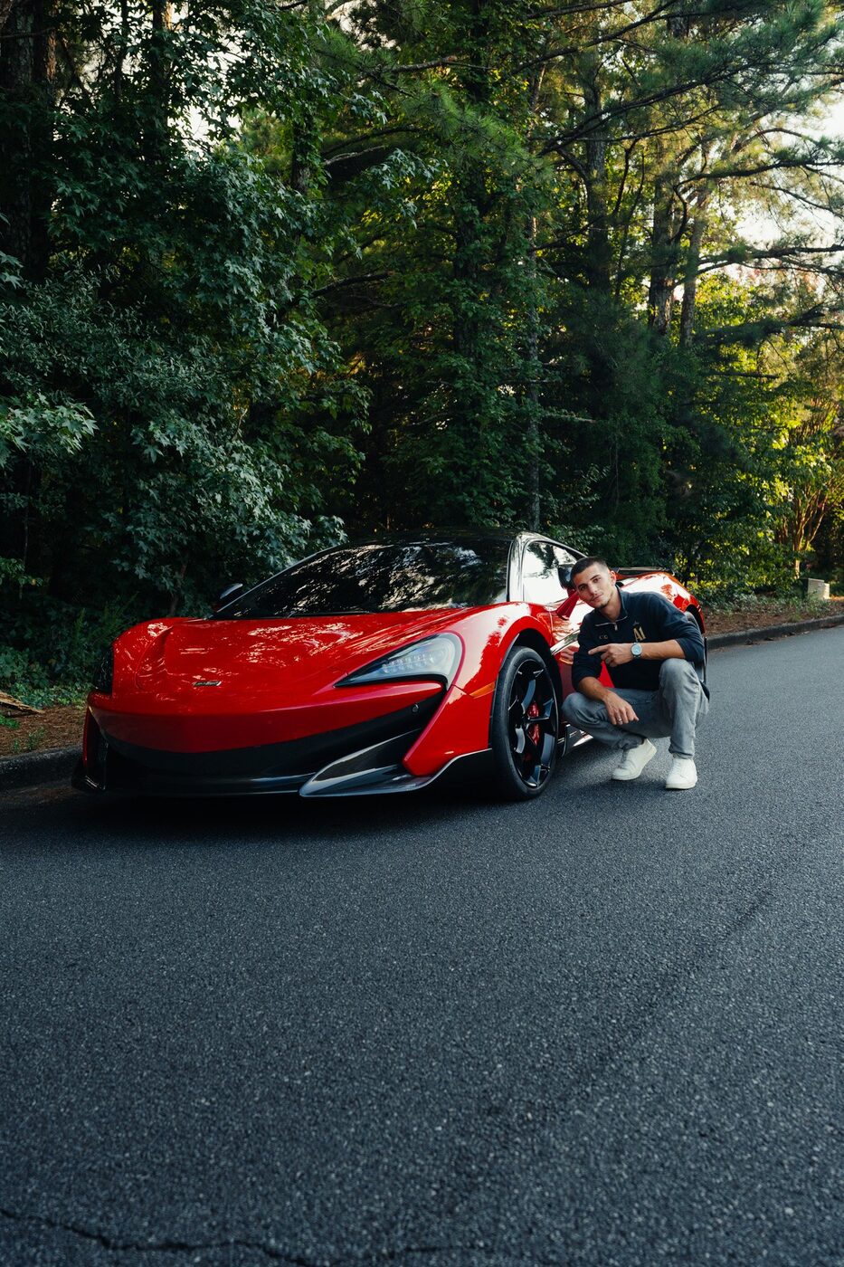 Red McLaren 600LT on a residential street